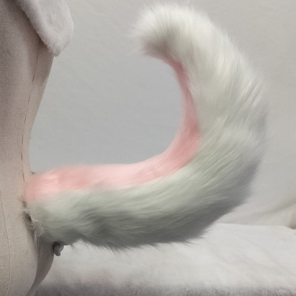 Pink and white tail simulation animal tail